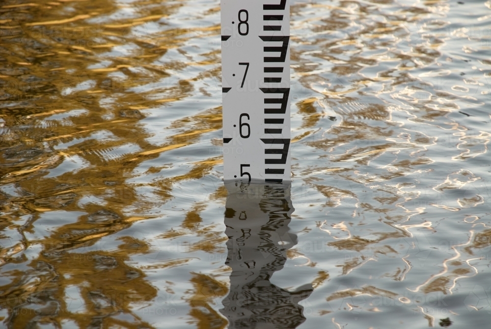 Flood depth gauge in deep water in a frequently flooding area. - Australian Stock Image