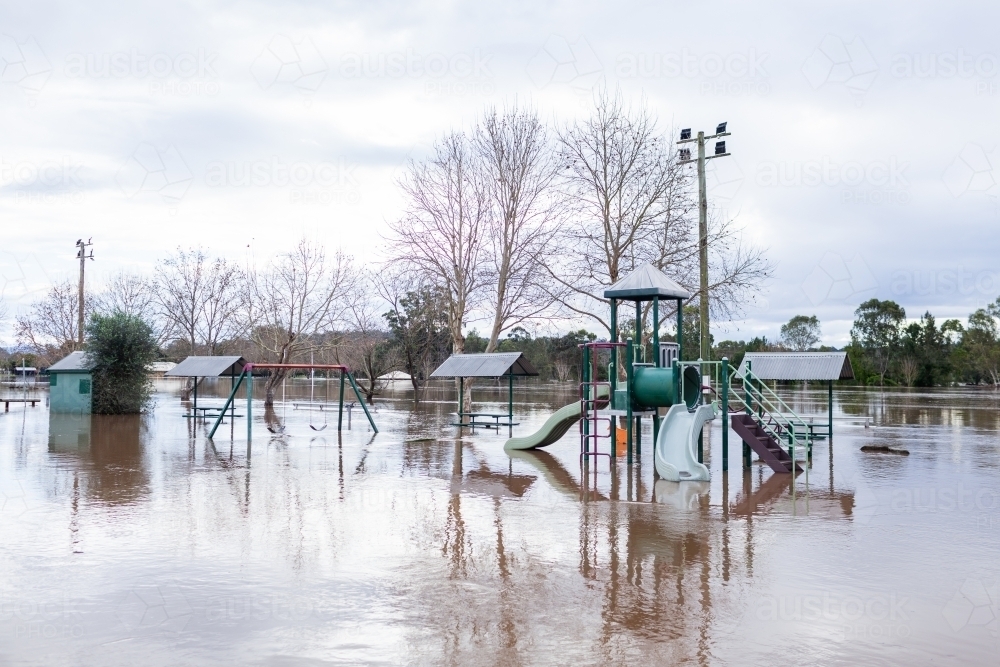 Image of flood water covering picnic area and park play equipment ...