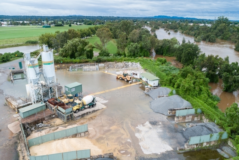 Flooding cement factory - concrete plant after river broke its bank - Australian Stock Image