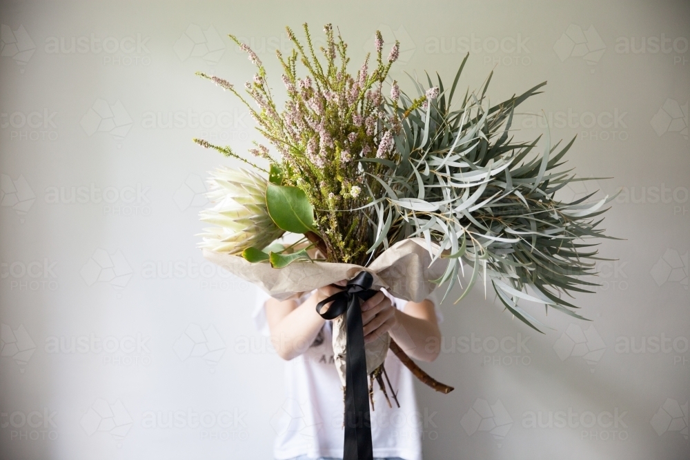Flower arrangement in a  florist's studio - Australian Stock Image