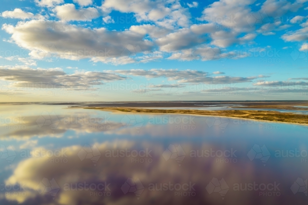 Flying with a drone over a salt lake with reflections - Australian Stock Image