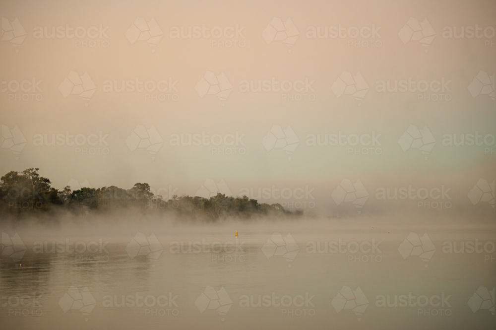 Fog mist morning on river at Mannum - Australian Stock Image