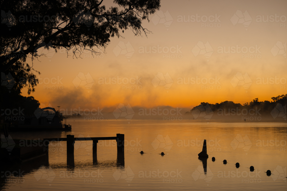 Fog mist morning on river at Mannum - Australian Stock Image