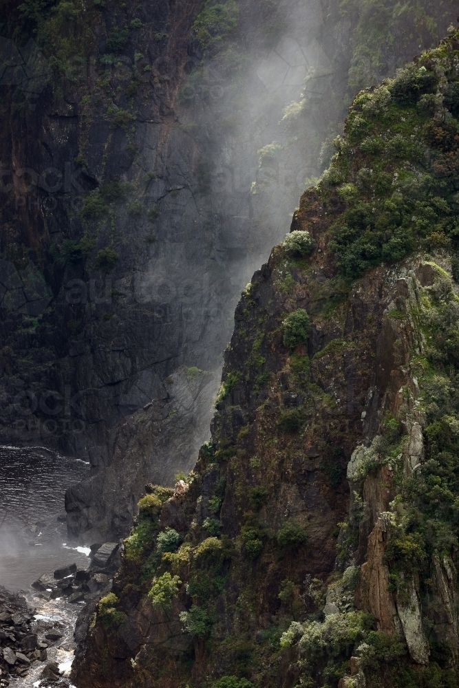 Foggy cliffside in ravine - Australian Stock Image