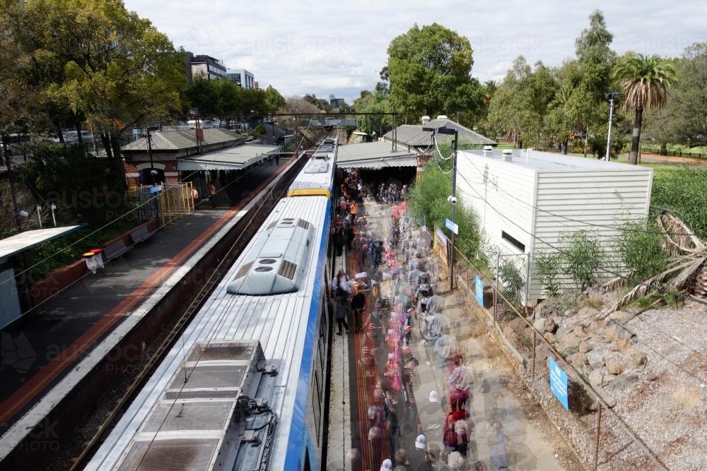 Football Crowd at Joilmont Station Getting off Train - Australian Stock Image