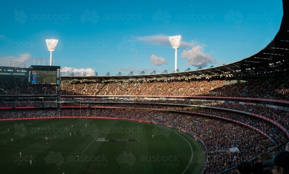 Football Played at MCG on a Late Sunny Afternoon - Australian Stock Image