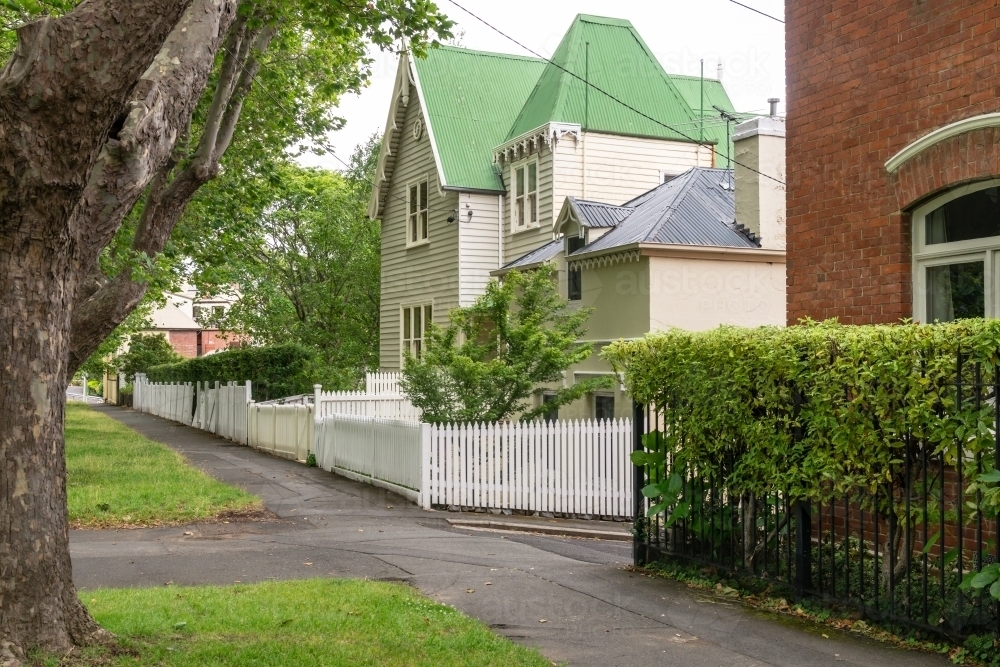 footpath in a quiet tree lined street of Hobart - Australian Stock Image