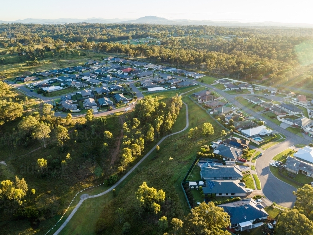 footpath through park connecting housing area on the edge of town - Australian Stock Image