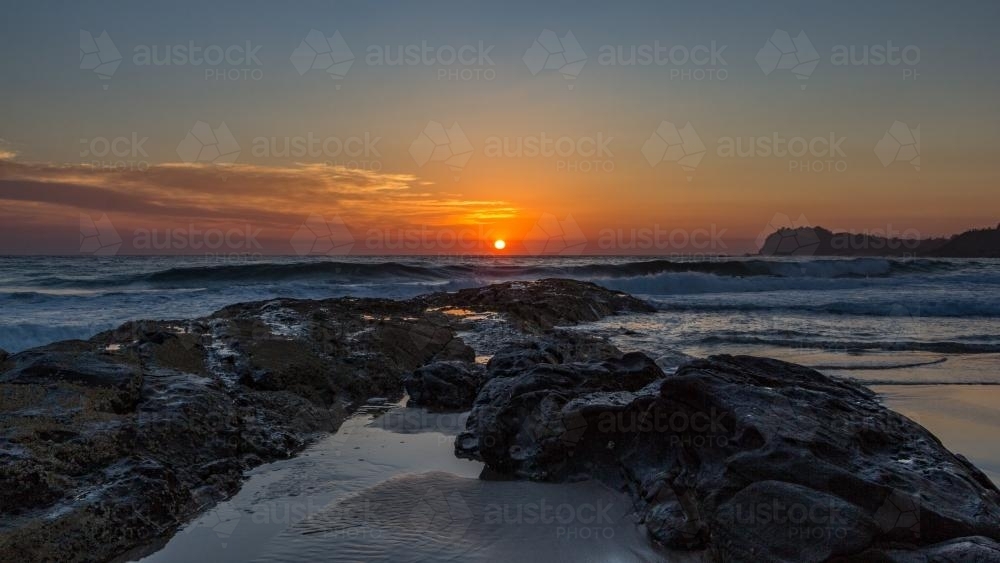 Forster rocky main beach at sunrise - Australian Stock Image