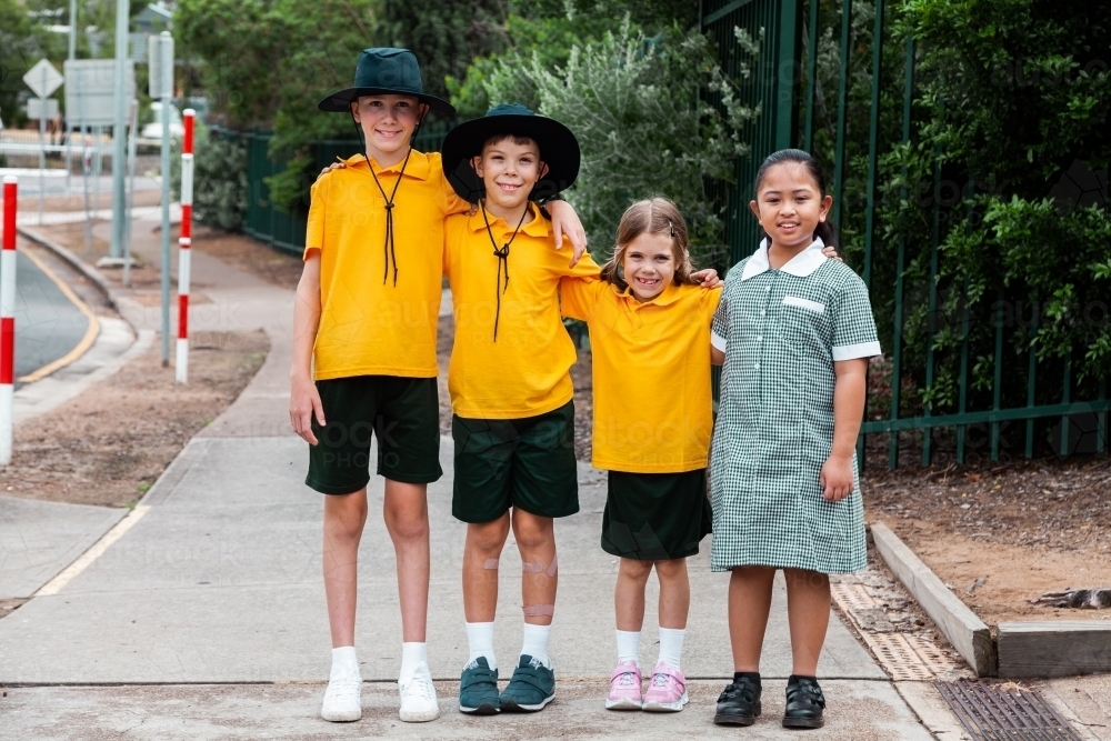 Four children of school age standing together - Australian Stock Image