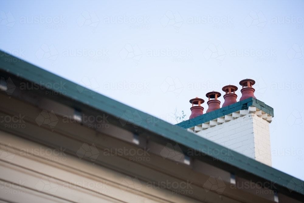Four chimney vents on a roof - Australian Stock Image