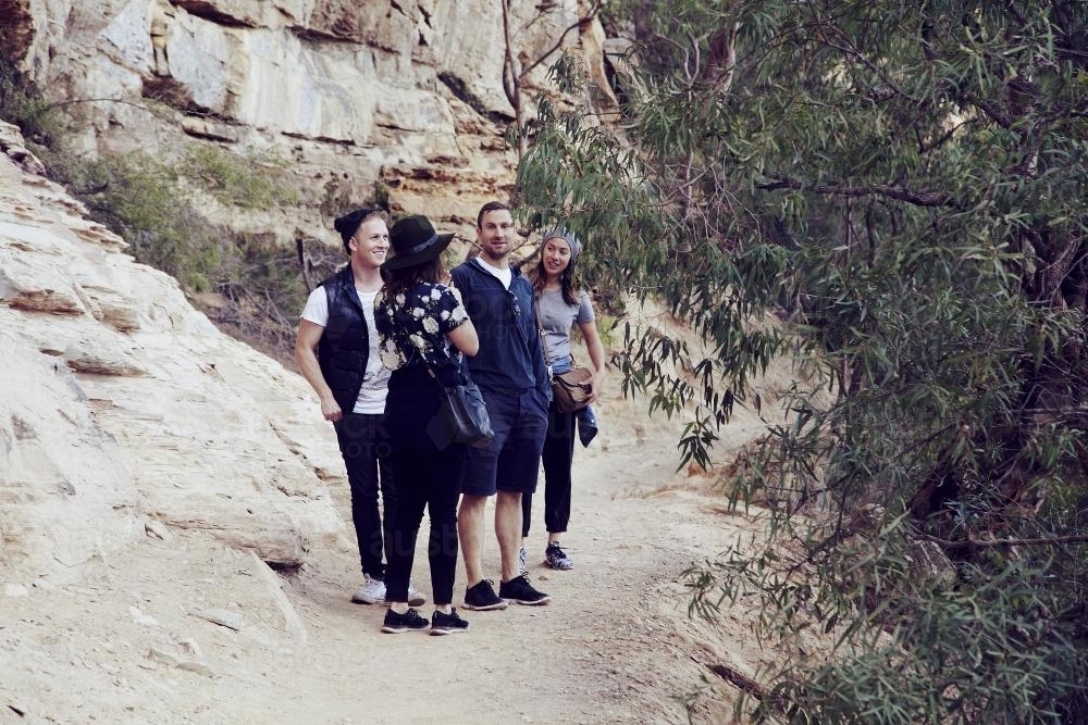 Four friends on a bush walk - Australian Stock Image