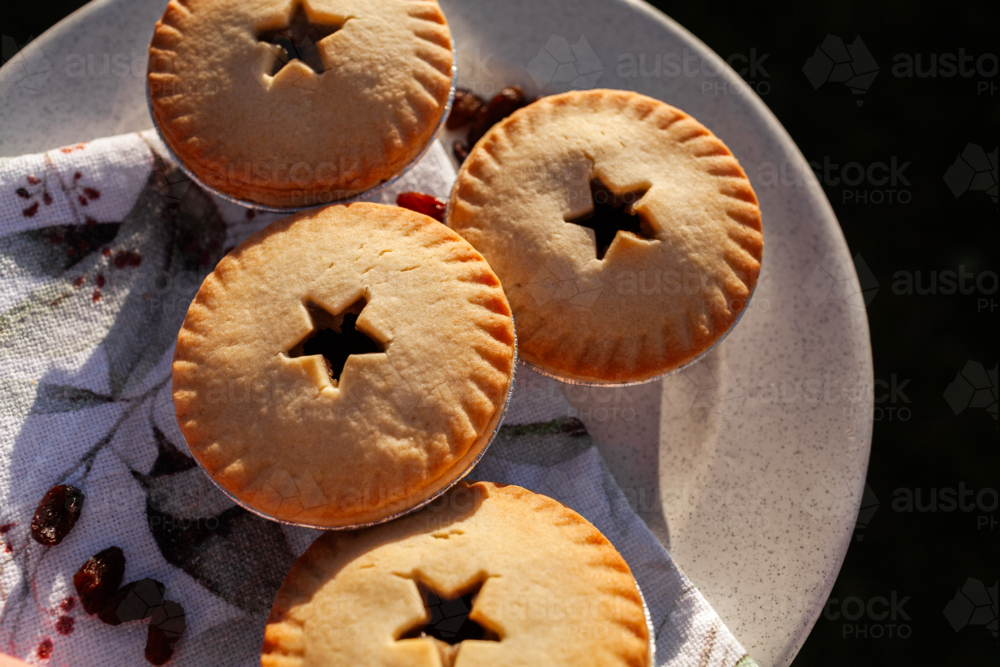 Image of Four fruit mince pies on plate for backyard Christmas party ...