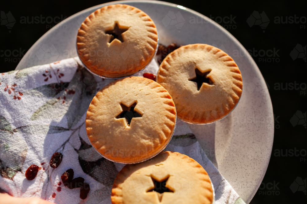 Image of Four fruit mince pies on plate for backyard Christmas party ...