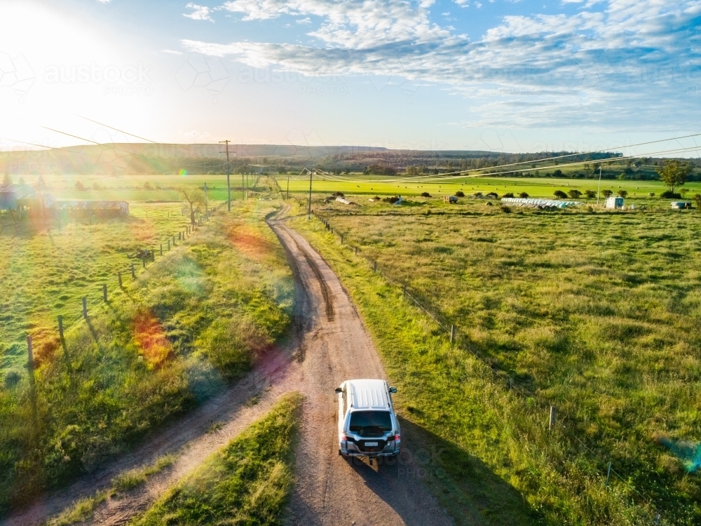 Four wheel drive car on country road trip driving on gravel road - Hope and adventure concept - Australian Stock Image