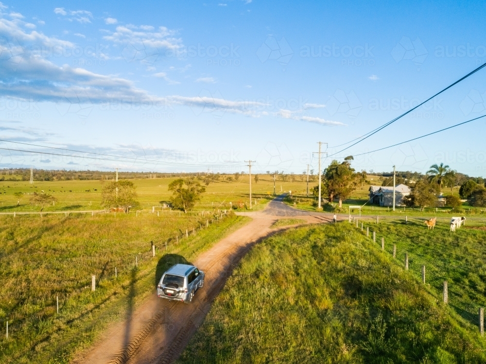 Four wheel drive car on country road trip driving on gravel road - Hope and adventure concept - Australian Stock Image