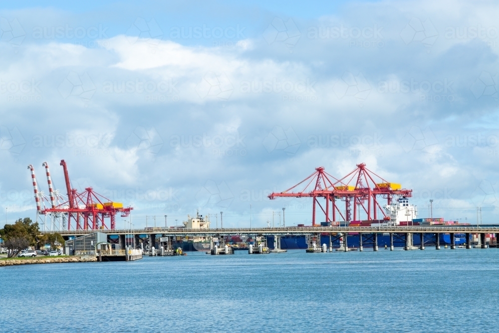 Fremantle Traffic Bridge in front of cranes at the Fremantle Container Terminal. - Australian Stock Image