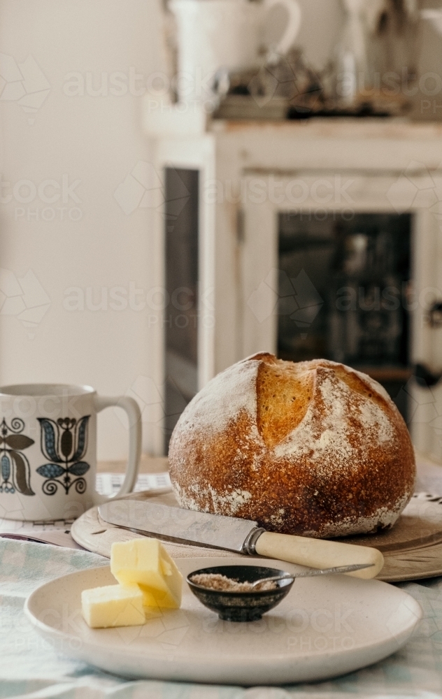 Fresh baked bread on the table. - Australian Stock Image