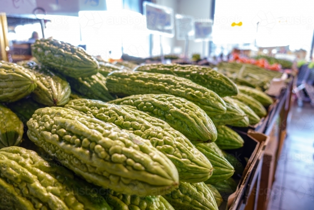 Fresh bitter gourd in food market. - Australian Stock Image