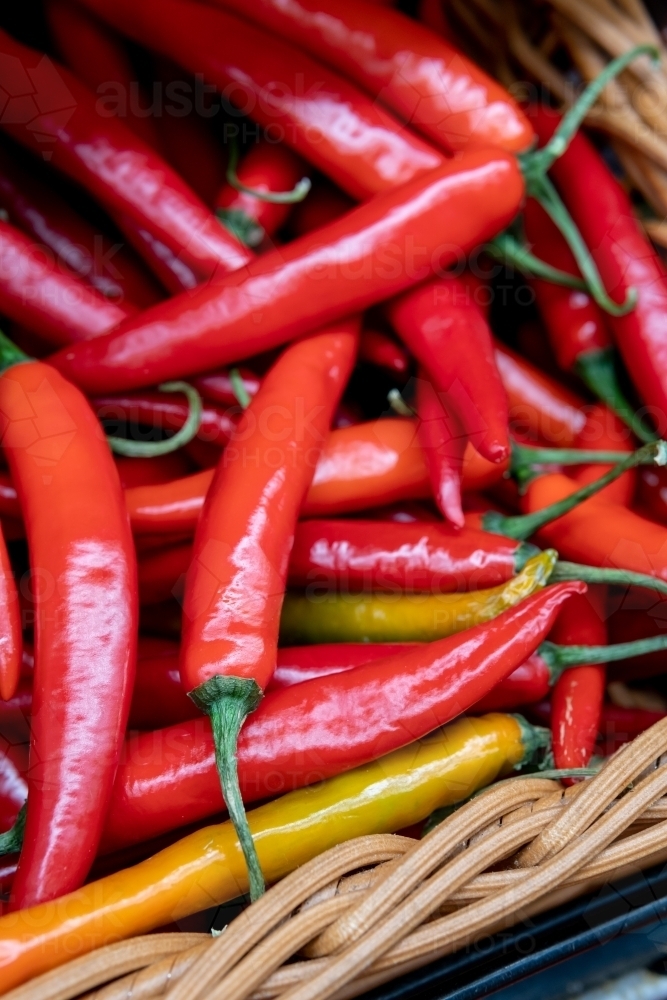 Fresh chillies in a basket. - Australian Stock Image