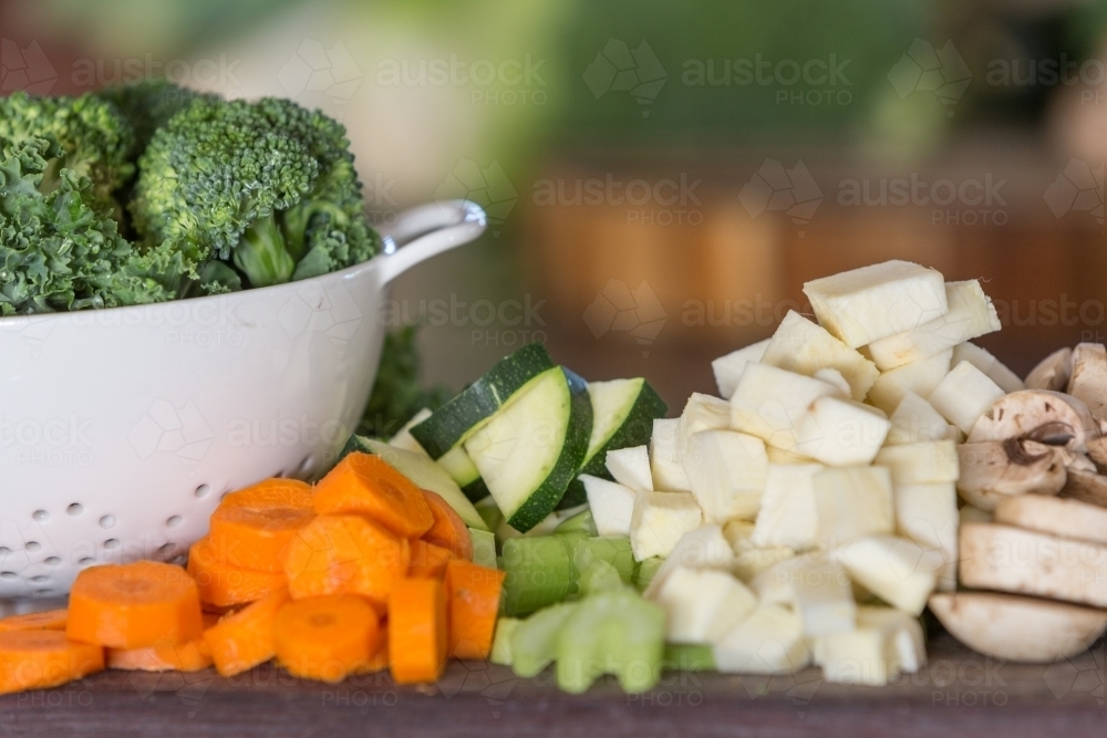 Fresh chopped vegetables on a cutting board - Australian Stock Image