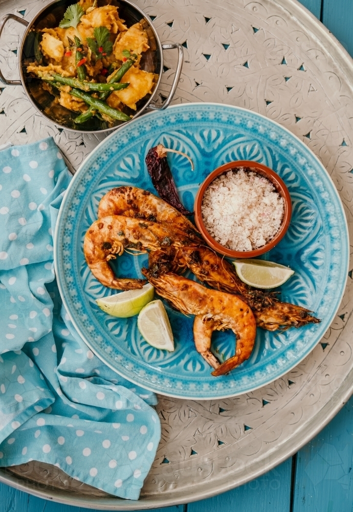 Fresh cooked prawns served with coconut and lime - Australian Stock Image