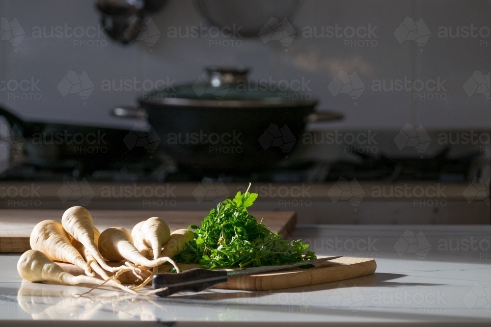 Fresh garden vegetables on the kitchen bench - Australian Stock Image