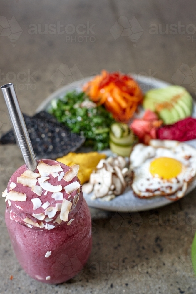 Fresh smoothie and healthy vegetarian meal ready to eat - Australian Stock Image