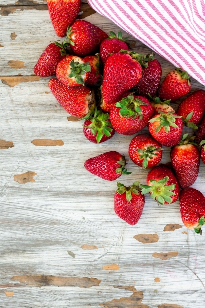 fresh strawberries on a wooden background - Australian Stock Image