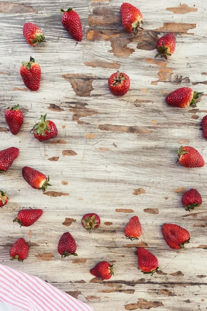 Fresh strawberries on a wooden background - Australian Stock Image