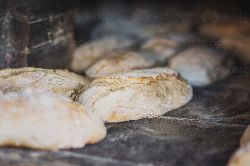 Freshly baked, wood fired bread loaves - Australian Stock Image