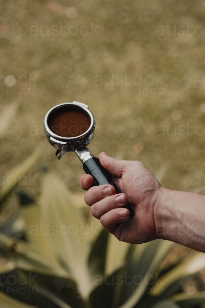 Freshly ground and tamped coffee ready to pull an espresso shot : Austockphoto Freshly ground and tamped coffee ready to pull an espresso shot - Australian Stock Image