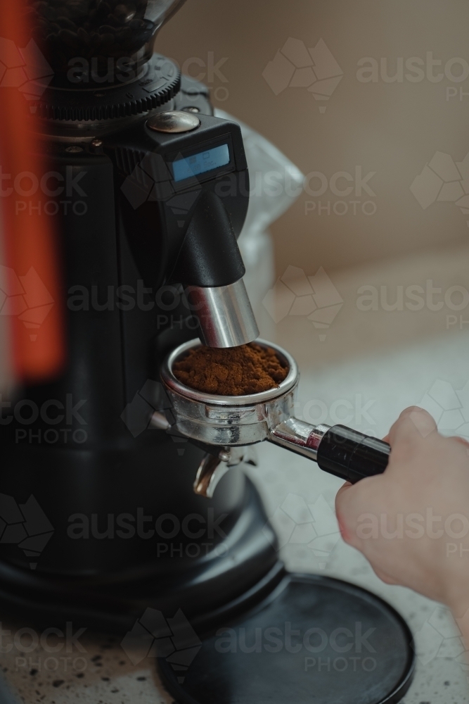 Freshly ground coffee from a grinder. - Australian Stock Image