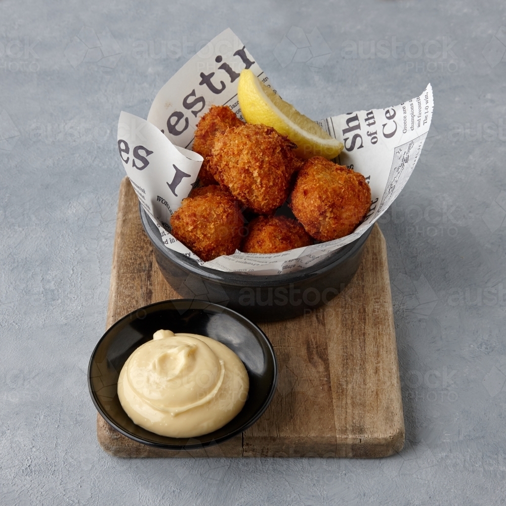 Fried cheese balls on table - Australian Stock Image
