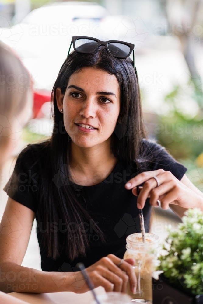 friends chatting in a cafe - Australian Stock Image