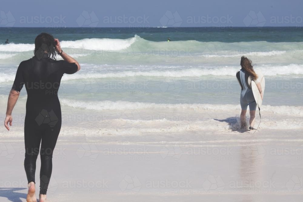 Friends checking out the surf - Australian Stock Image