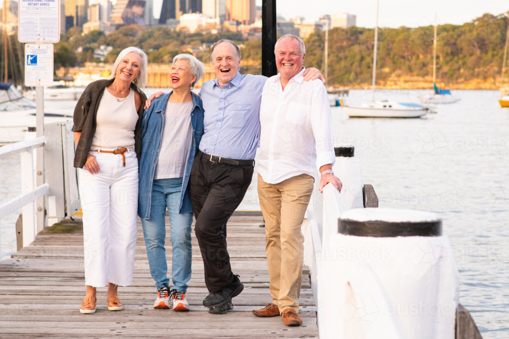Friends Enjoying a Waterfront Walk - Australian Stock Image
