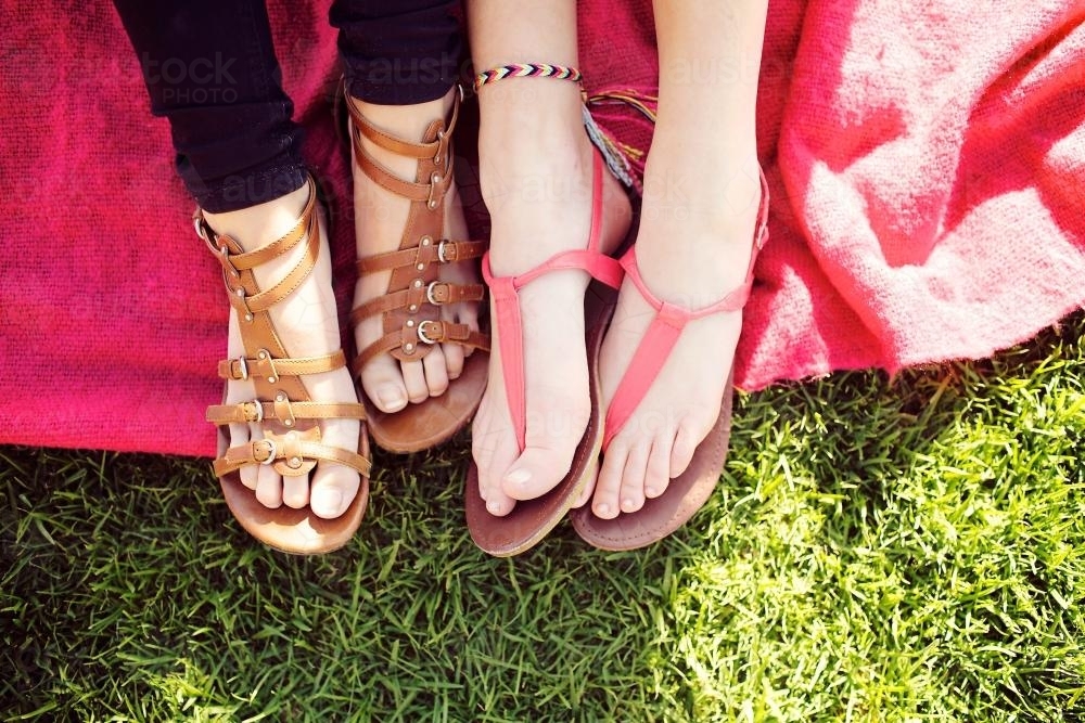 Friends feet on a blanket - Australian Stock Image