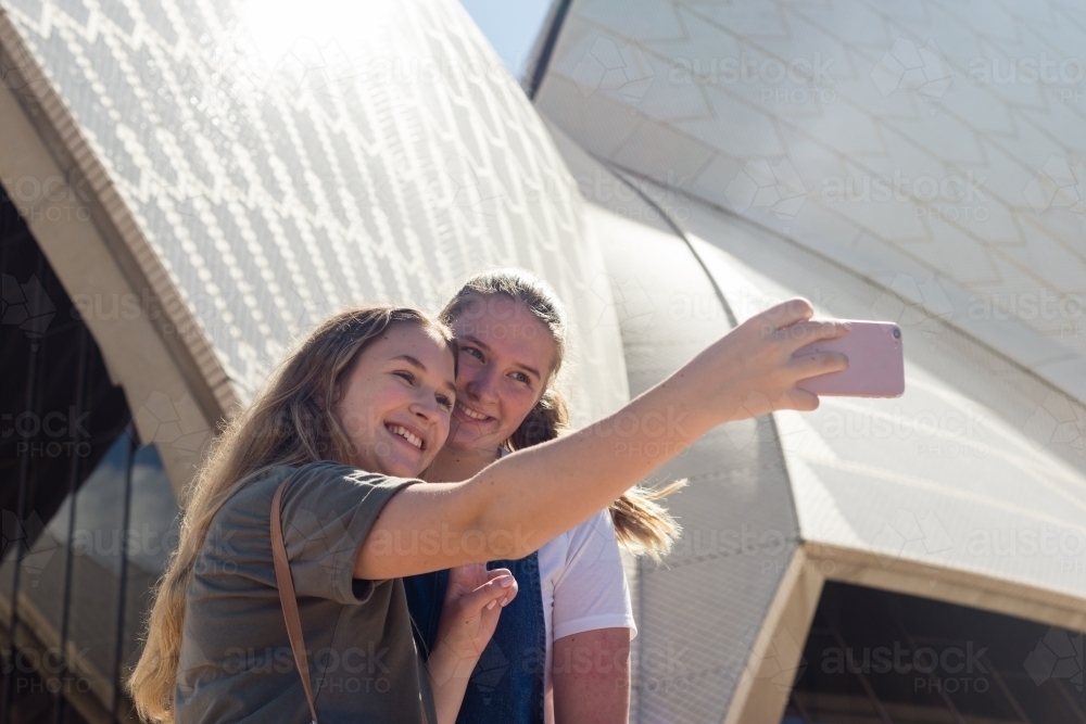 friends taking selfie at sydney opera house - Australian Stock Image