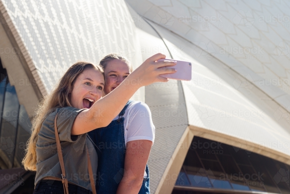 friends taking selfie at sydney opera house - Australian Stock Image