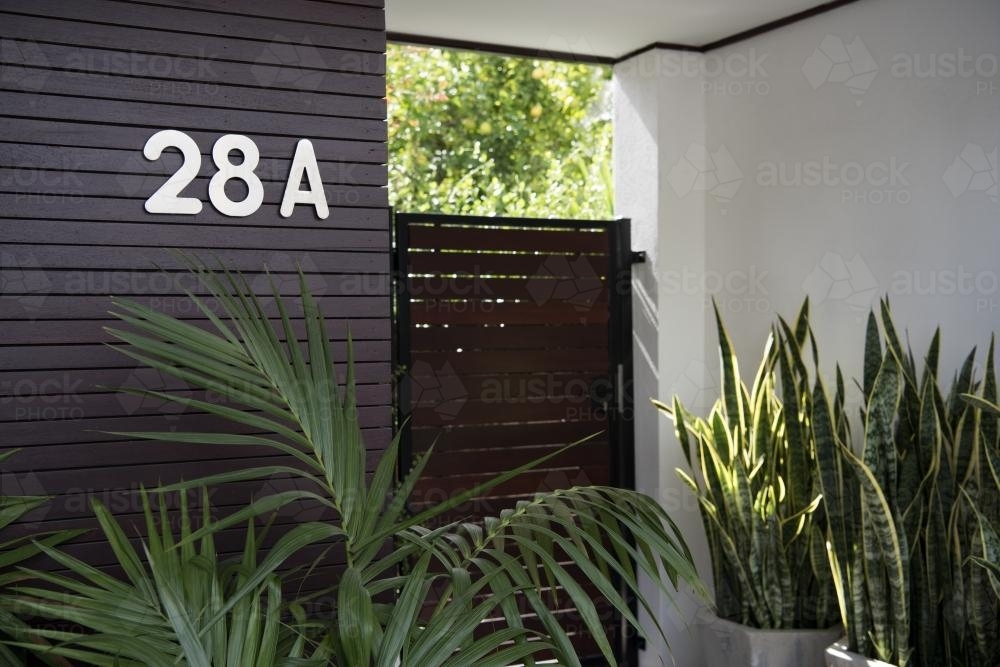 Front entry to stylish home unit with plants - Australian Stock Image