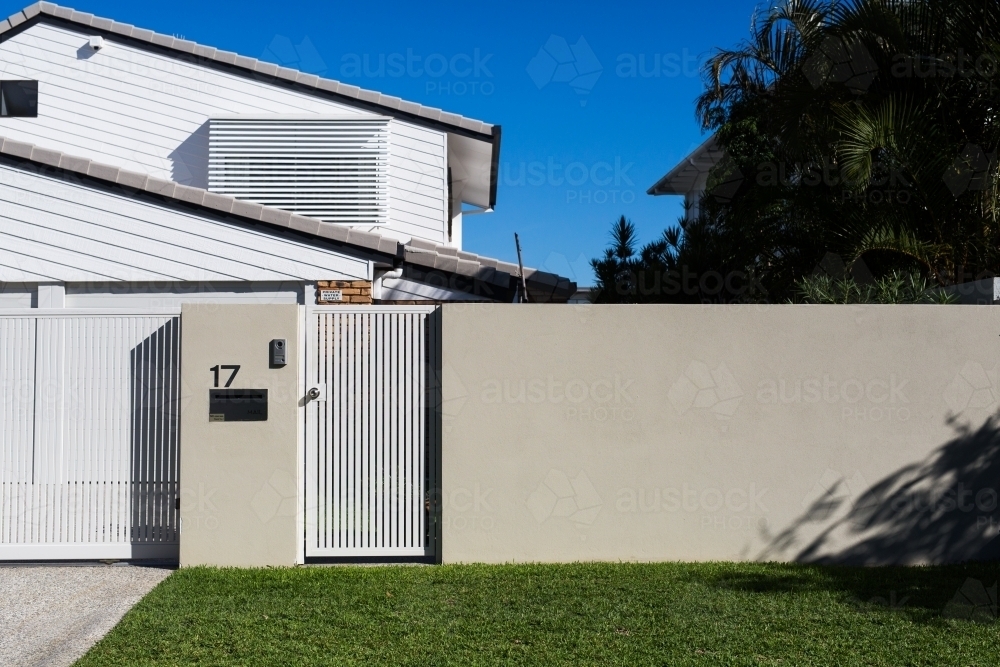 Front gate,mailbox and lawn of a house in Noosaville, queensland - Australian Stock Image