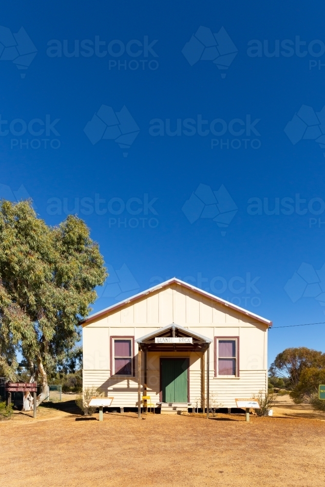 front view of old Bonnie Rock hall with big blue sky - Australian Stock Image