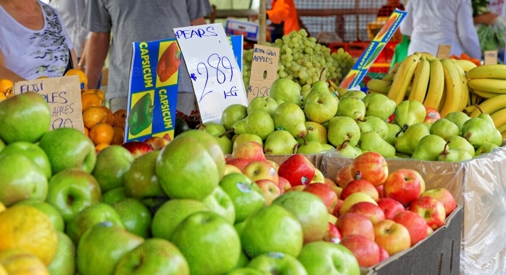 Fruit stall at Redcliffe farmers market with apples, bananas and pears - Australian Stock Image