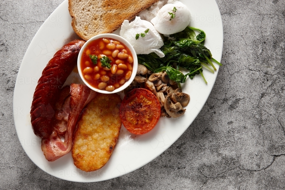 Full breakfast meal served on a white plate - Australian Stock Image