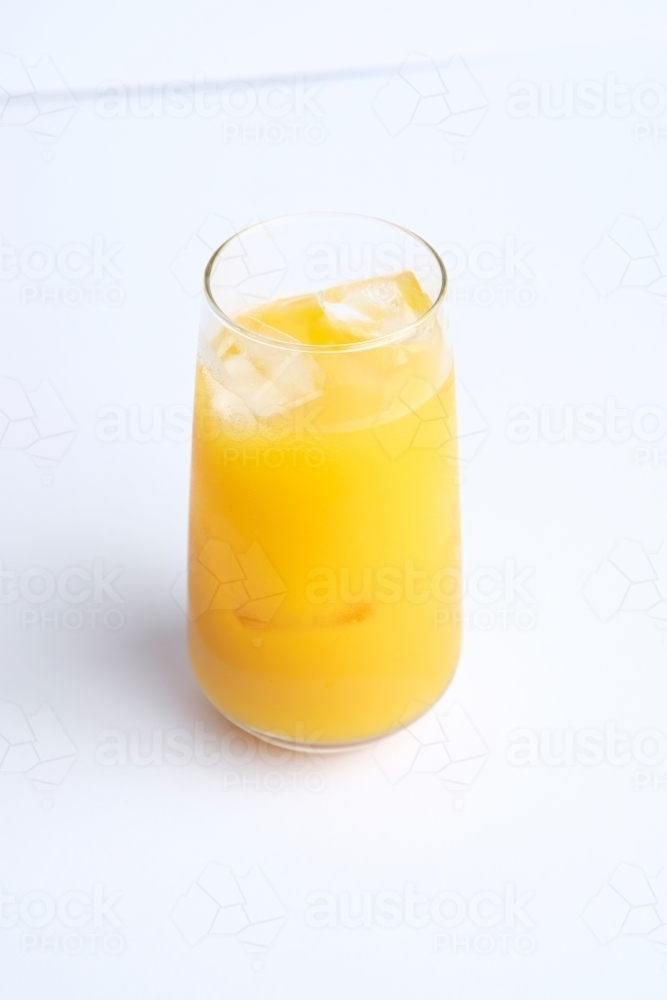 Full glass of ice and orange juice - Australian Stock Image