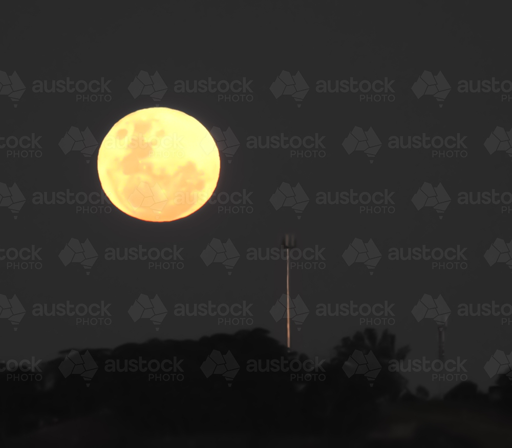full moon mt annan with communications towers - Australian Stock Image