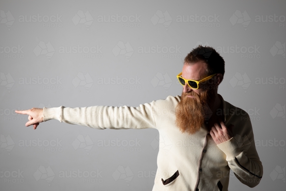 Man Funky Image of Funky man posing for photographs, wearing a beige shirt ...
