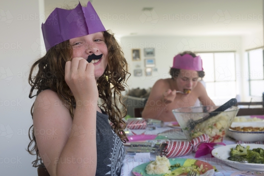 Funny girl at christmas dinner - Australian Stock Image