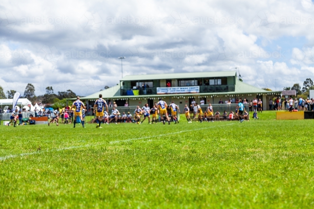 Game of rugby league in motion on green sports oval - Australian Stock Image